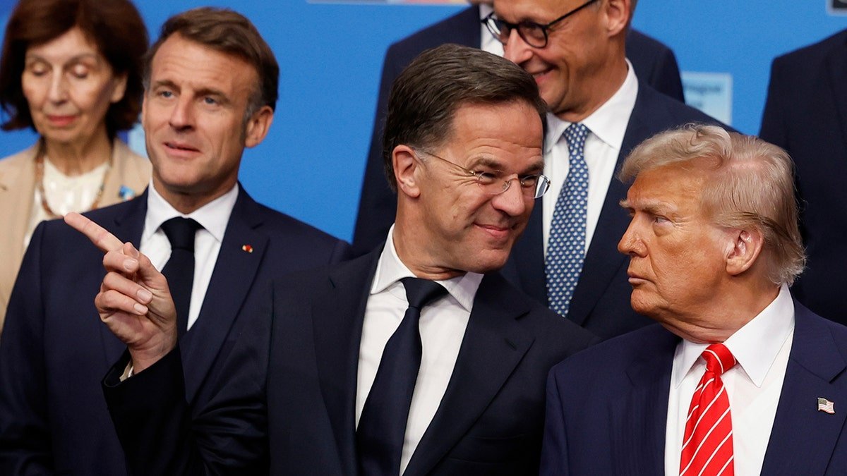 Roti smiles in Trump during the NATO image