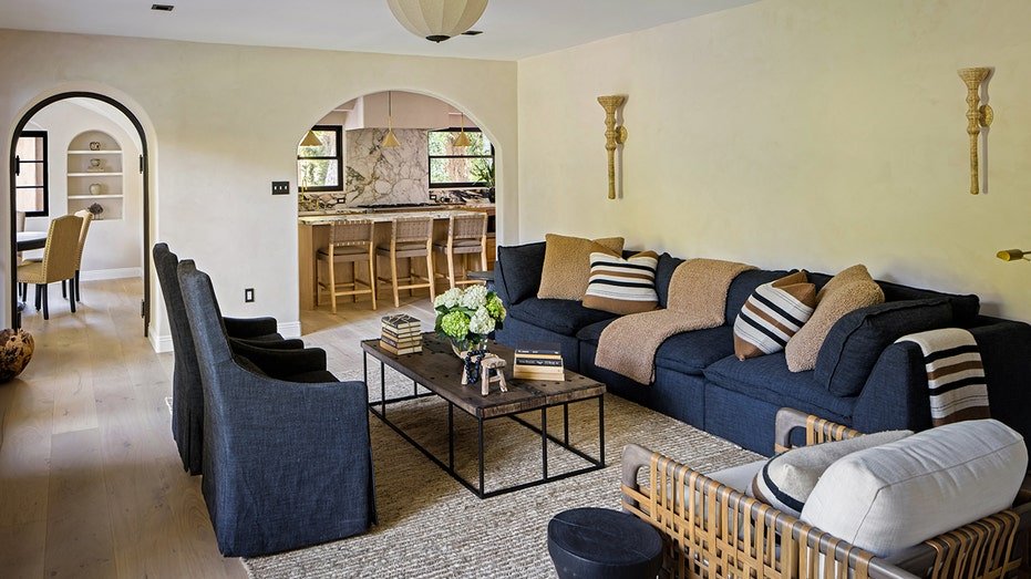 The family room features a candlestick and double doors leading to the backyard.