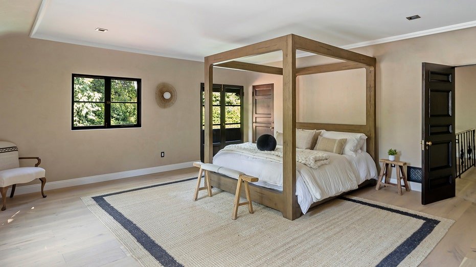 The interior bedroom has access to a balcony and wardrobe.