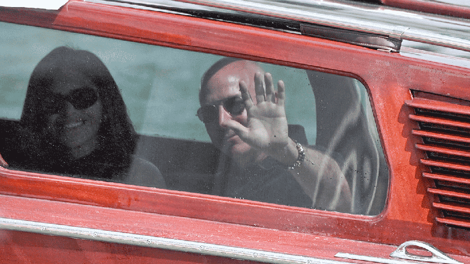 Topshot- The founder of Amazon Jeff Bezos and Lauren Sanchez Wave from the Garb of Taxi Car when they arrive at the Aman Hotel on June 25, 2026. Celebrities are sailing in the super yacht in Venice this week for the Amazon wedding that is an integral day of a three-day. According to what was reported, Qutb called for about 200 guests to marriage parties worth millions of dollars in the Italian city, which is expected to start on June 26 and end on Saturday with a party at a secret site. (Photo by Marco Sabadin / AFP) (Photo by Marco Sabadin / AFP via Getty Images)