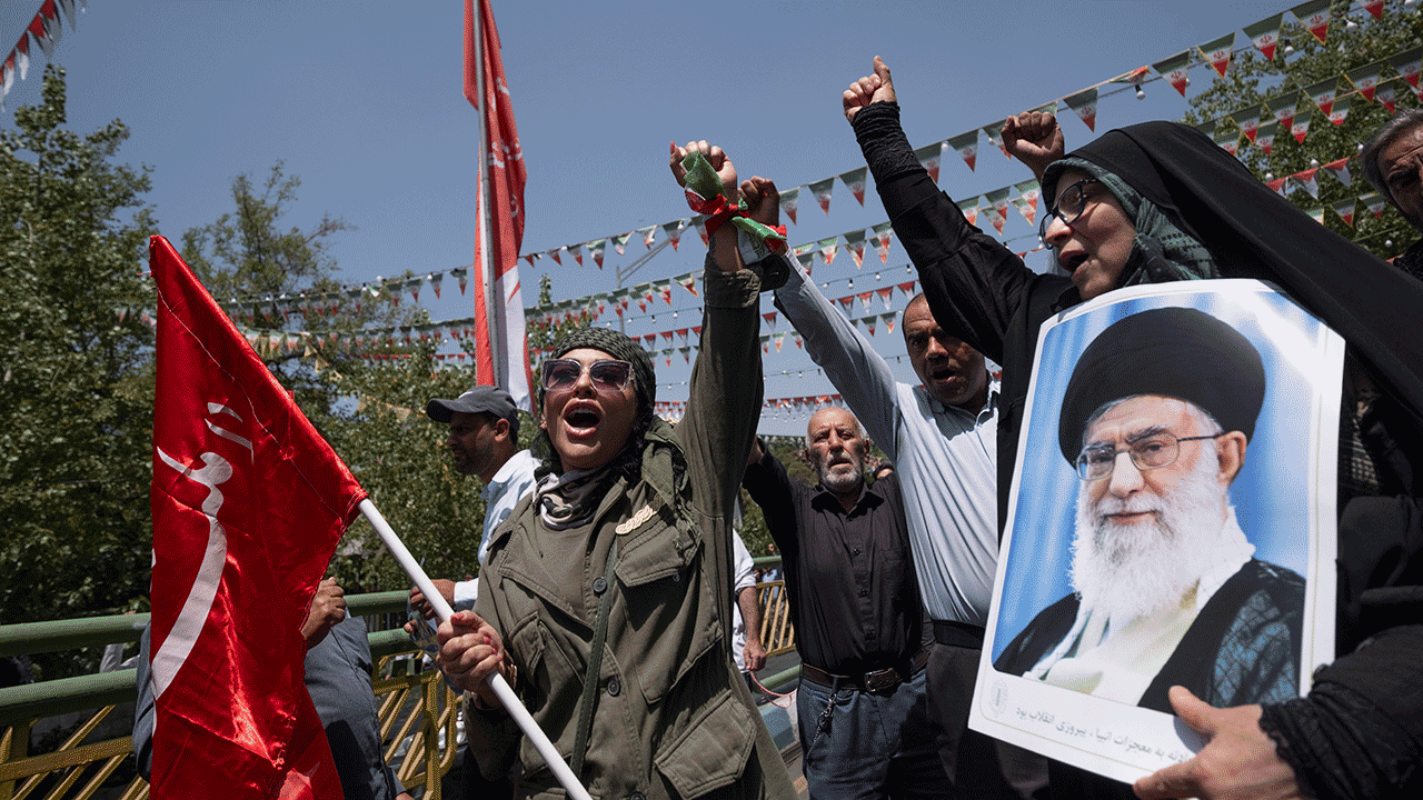 Iran's demonstrators with a poster for the supreme leader Ayatollah Ali Khawni