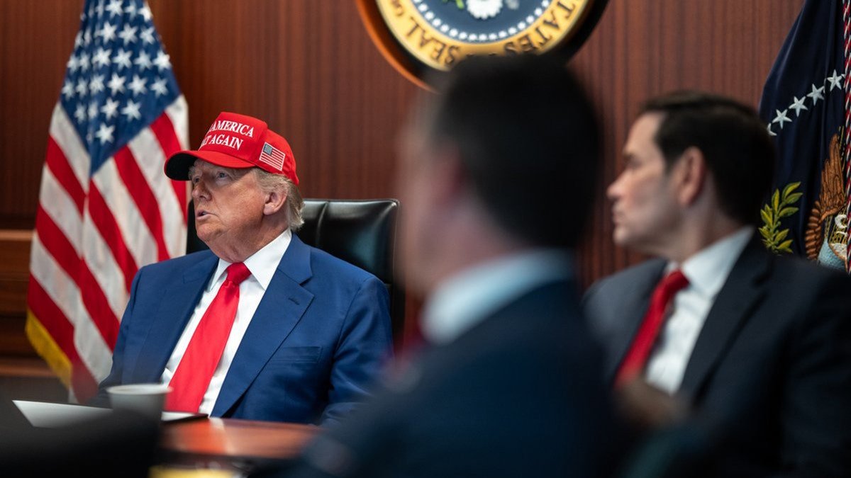 President Donald Trump wears the Maga hat in the situation room