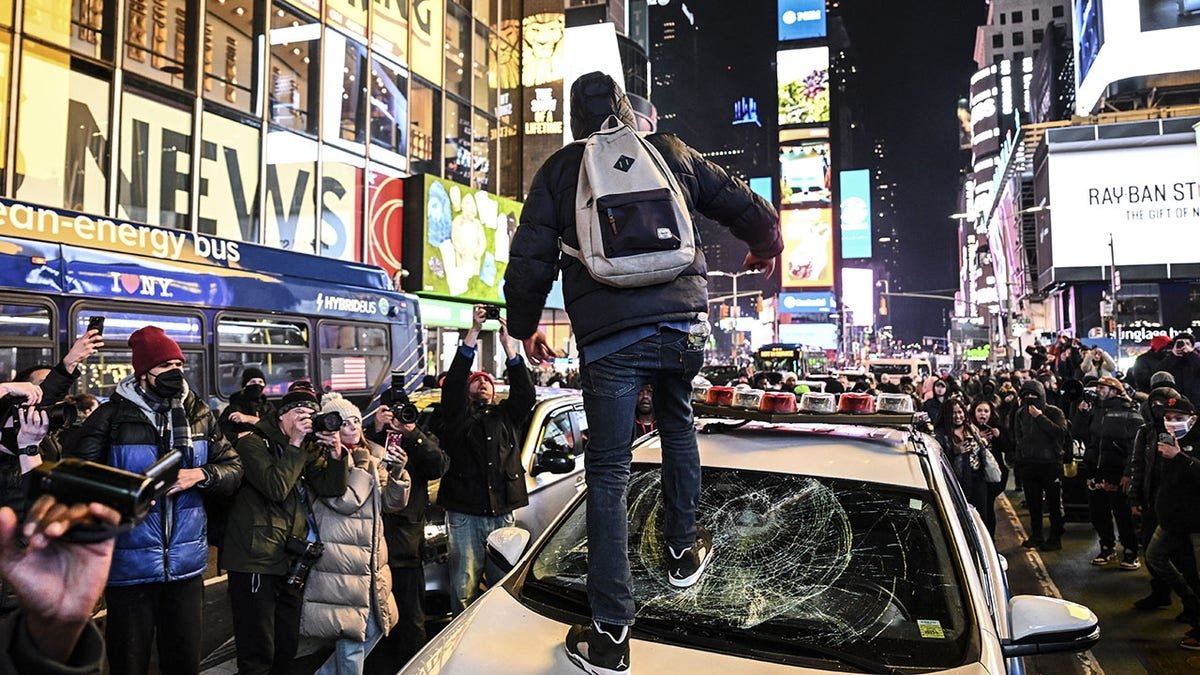 A man broke the windshield of the police car in Times Square in January 2023