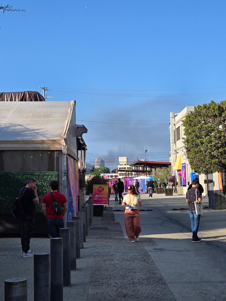 Black smoke caused by burning Waymo vehicles hovers during the 2025 summer playing days.