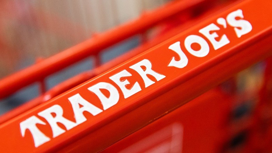 Signs on the TRADER JOE's shopping cart