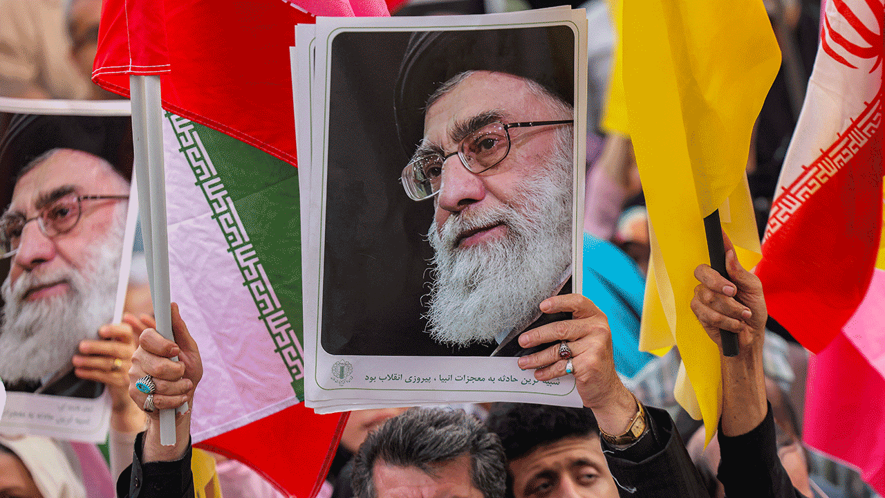 The Supreme Leader, Ayatollah Ali Khawni, is on a demonstration poster