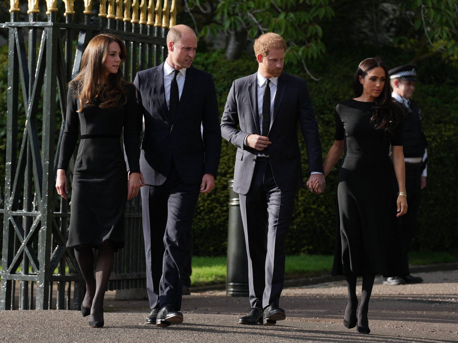 The prince and princess in Wales along with Prince Harry, Meghan Markle Duke and the Duchess of Sussex show a greeting in Windsor