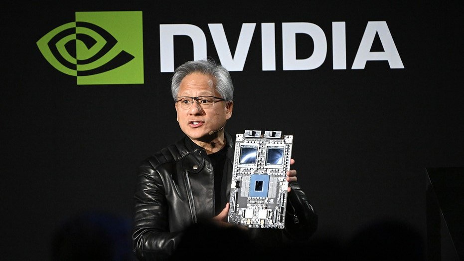 Nvidia Jensen Huang CEO holds a chip