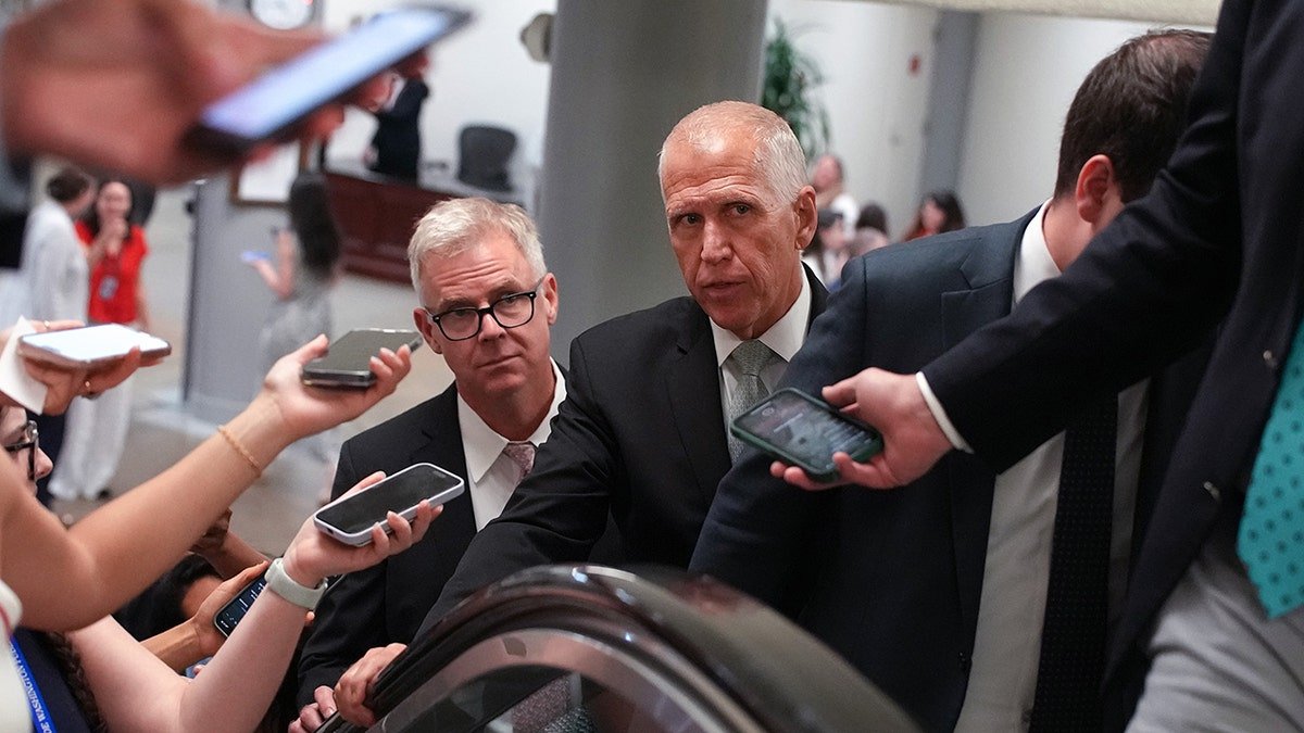 Telis speaks to the correspondents