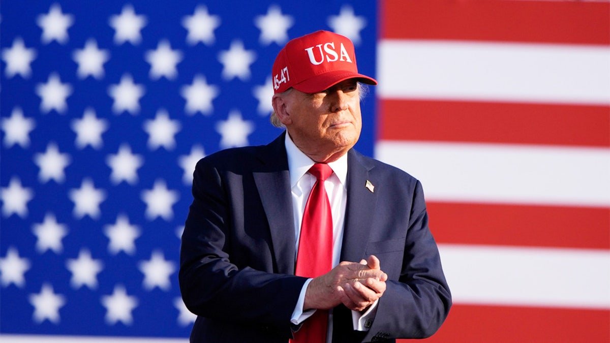 Trump in front of the American flag