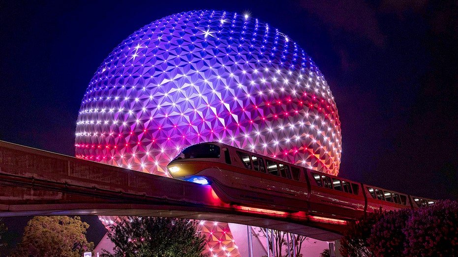 The Earth's space ship in a Disney world lit in red, white and blue