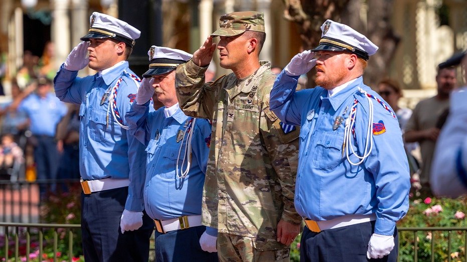 American Colonel Sean Bolt participates in a special decline in Disney World