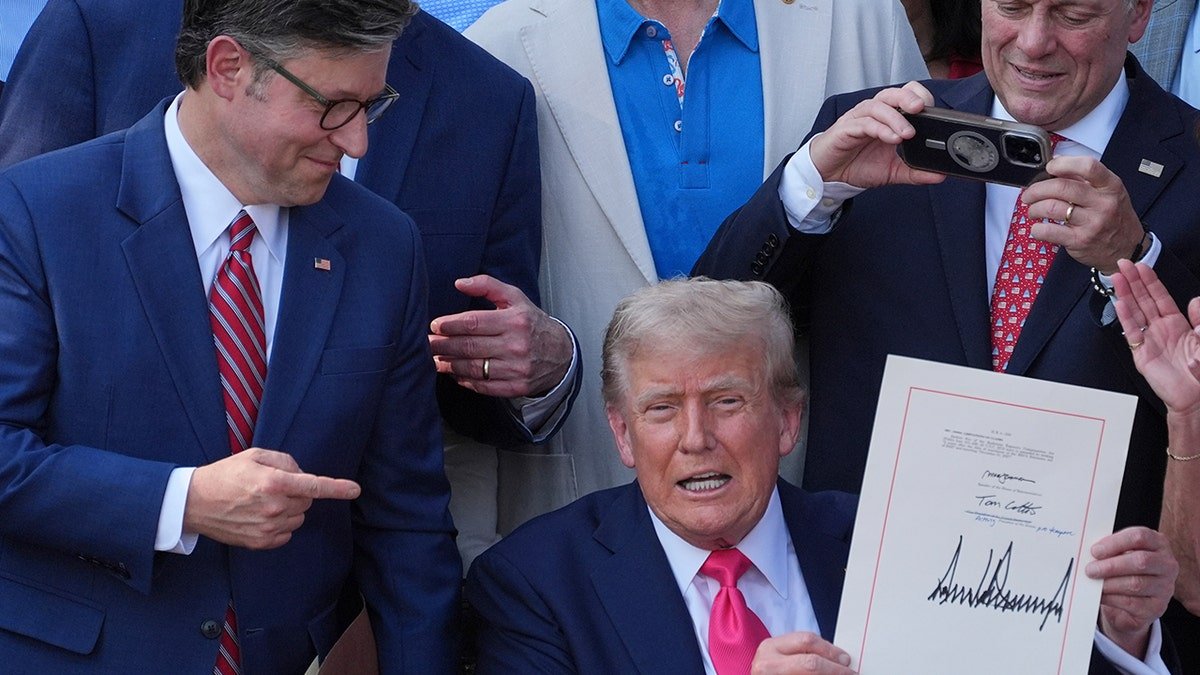 Trump holds a large and beautiful bill in the White House