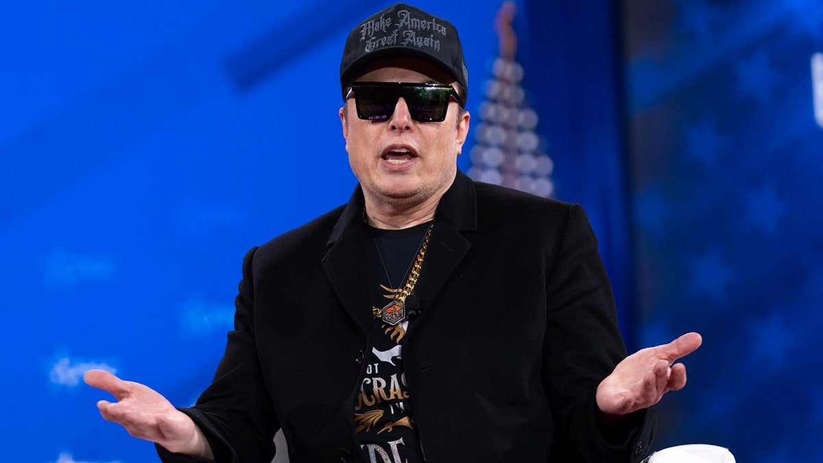 Elon Musk wears all black