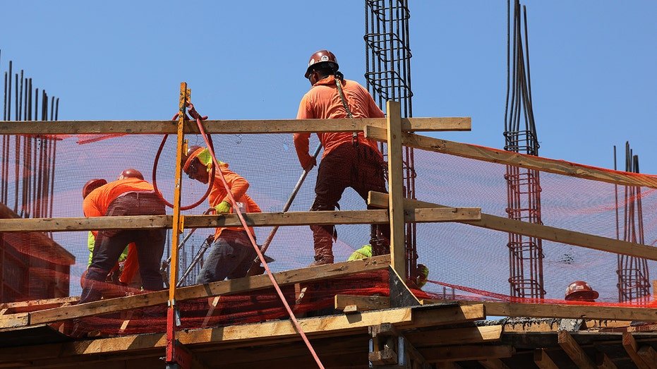 Building workers work on the construction site