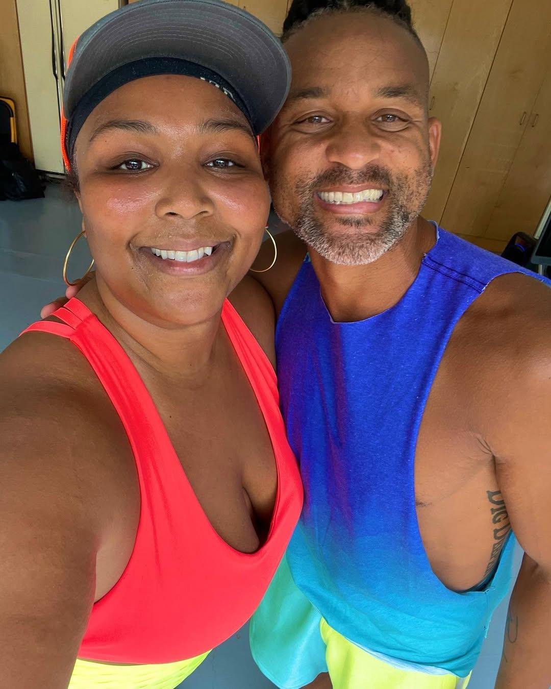 Shaun T and Lizzo demonstrate together after an exercise on Instagram.