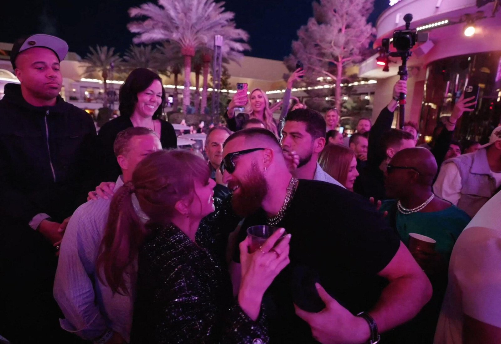 Taylor Swift and Travis Kelce Dance and Kiss at Xs Nightclub while Kansas City Chief celebrates Super Bowl.