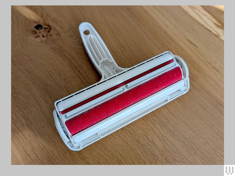 Chom Chom Roller Pet Hair Remover, a white plastic roller for collecting pet hair