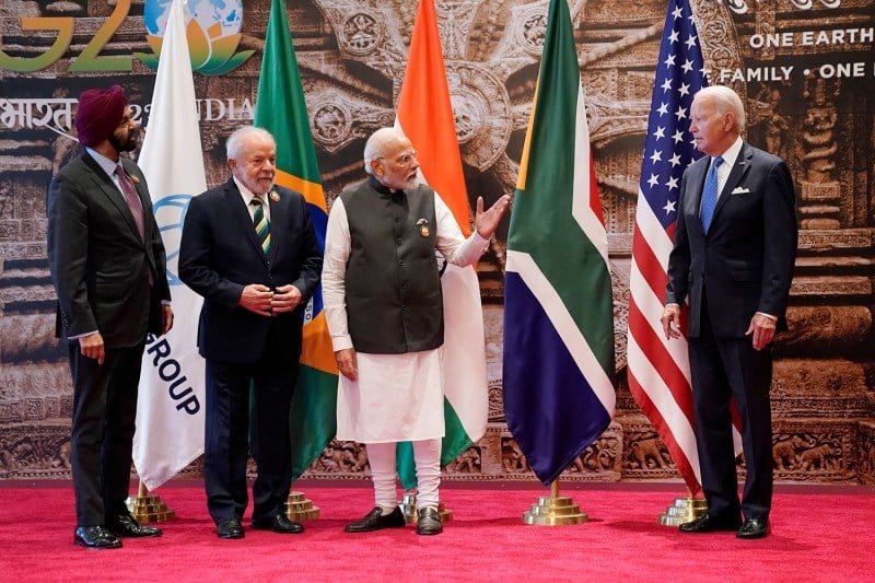 From left: World Bank President Ajay Banga, Brazilian President Luiz Inácio Lula da Silva, Indian Prime Minister Narendra Modi, and U.S. President Joe Biden wait for the arrival of South African President Cyril Ramaphosa for a group photo at the G-20 leaders’ summit in New Delhi.