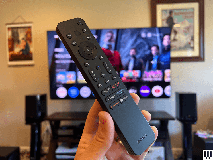 Image may contain: La Parka, Computer Hardware, Electronics, Hardware, Monitor, Screen, TV, Remote Control, and Person