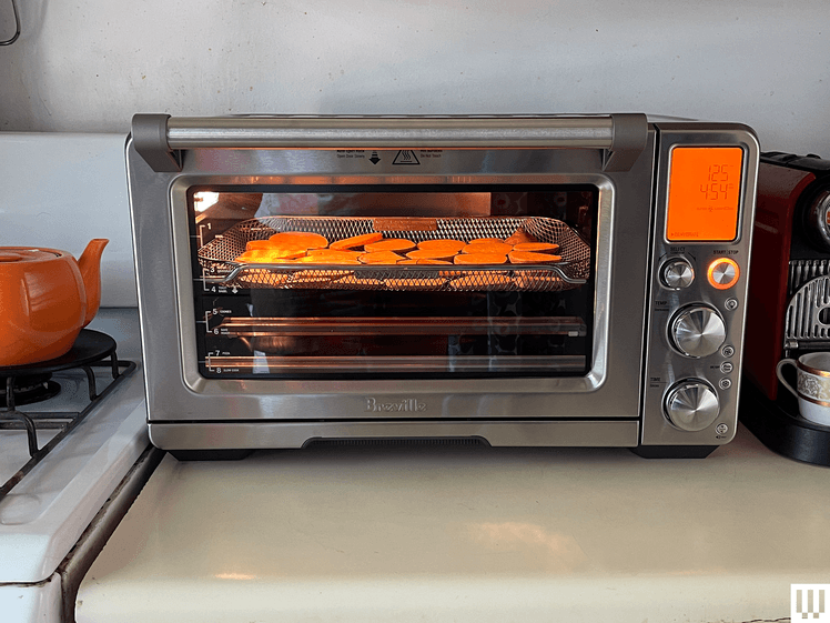 Image may contain: Device, Appliance, Electrical Device, Microwave, Oven, Burger, Food, Cooking, and Roasting