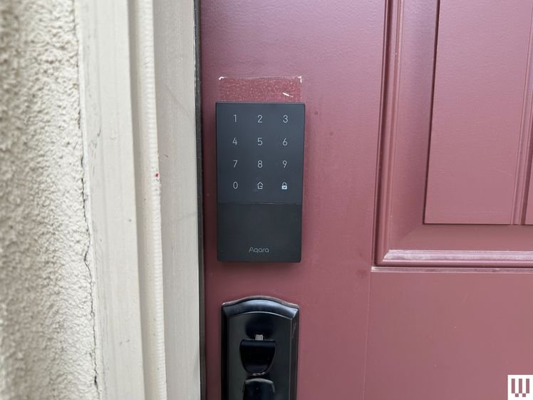 Front view of Aqara U50 Smart Lock on a red door.