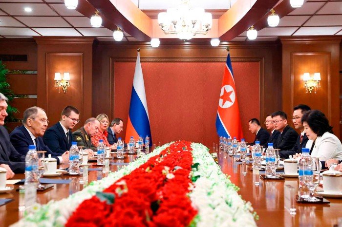 Sergey Lavrov, the second left, attends talks with North Korean Foreign Minister Choi Sun Hui, opposite, sitting around a table with each of them, in Wensan