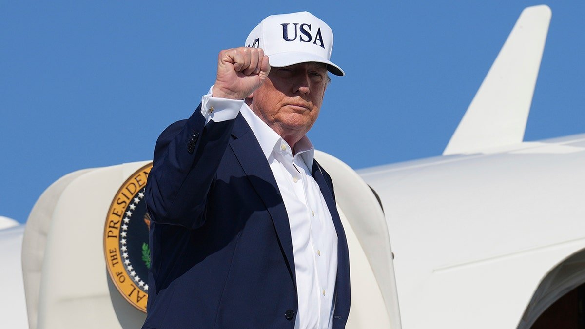 President Donald Trump pumps a fist