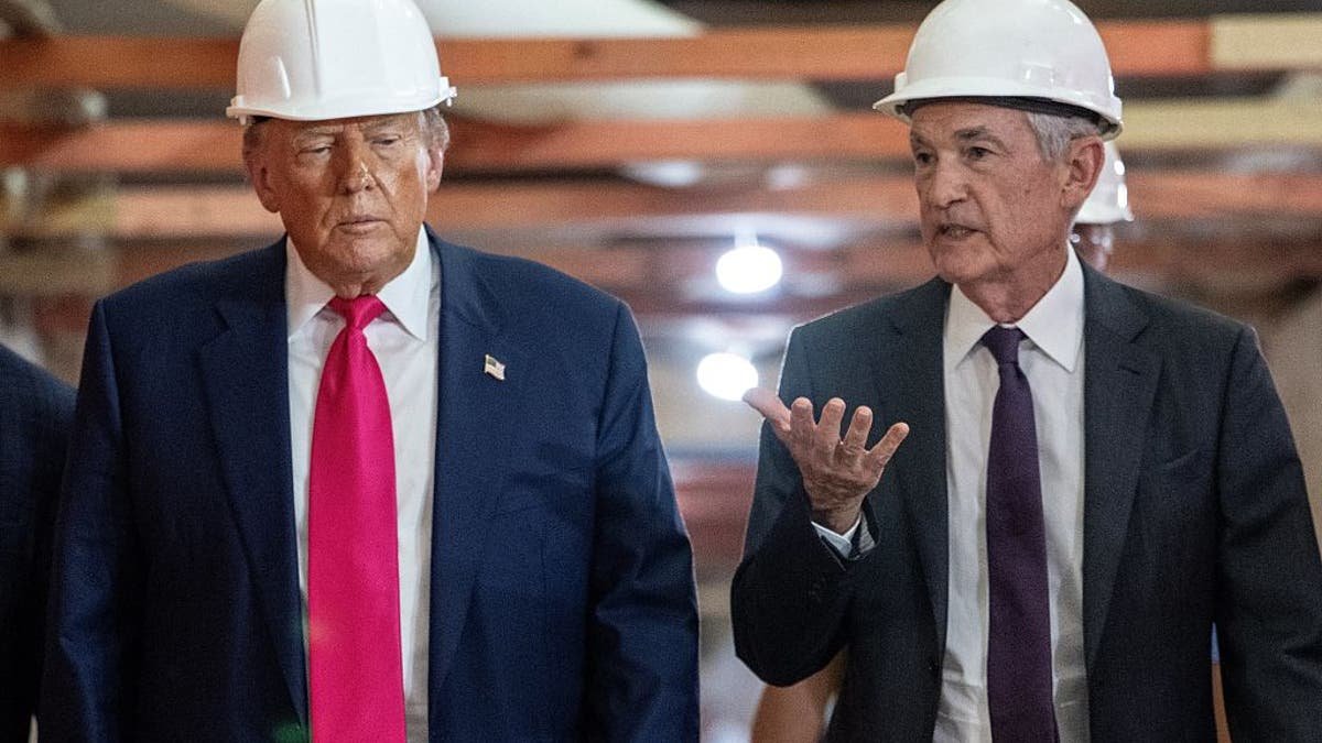 President Donald Trump speaks with Federal Reserve Chairman Jerome Powell (right) visiting the Federal Reserve in Washington, July 24, 2025.