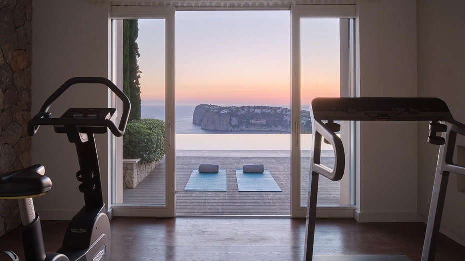 The house also includes a gym looking to a stunning view of the ocean.