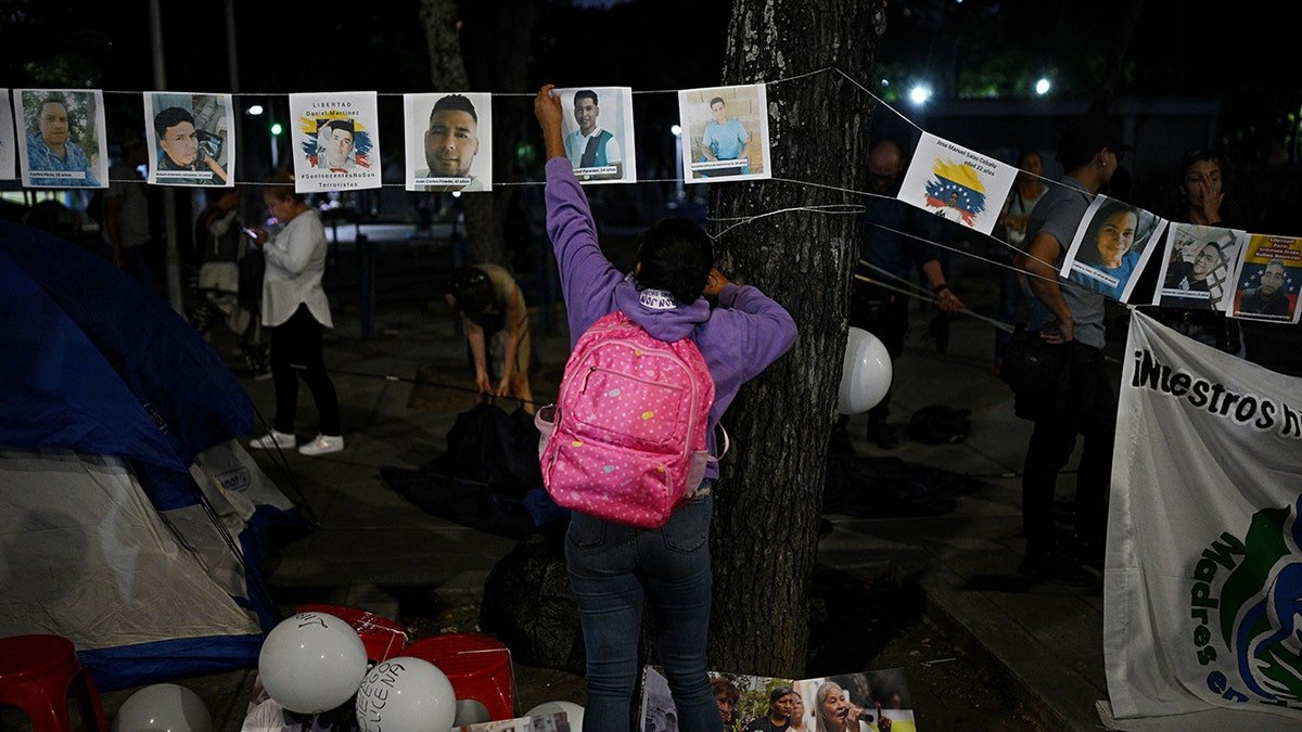 Venezuelans put stickers for missing demonstrators