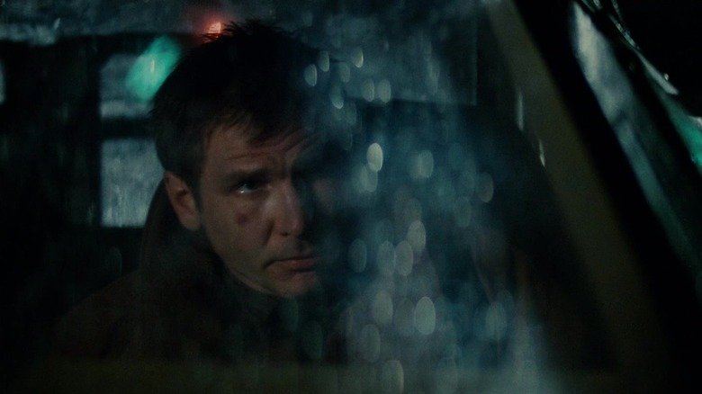Rick Dikard from Harrison Ford looks from his car's windshield