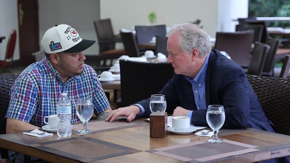 Parisia, the left, with Senator Van Holin on the table