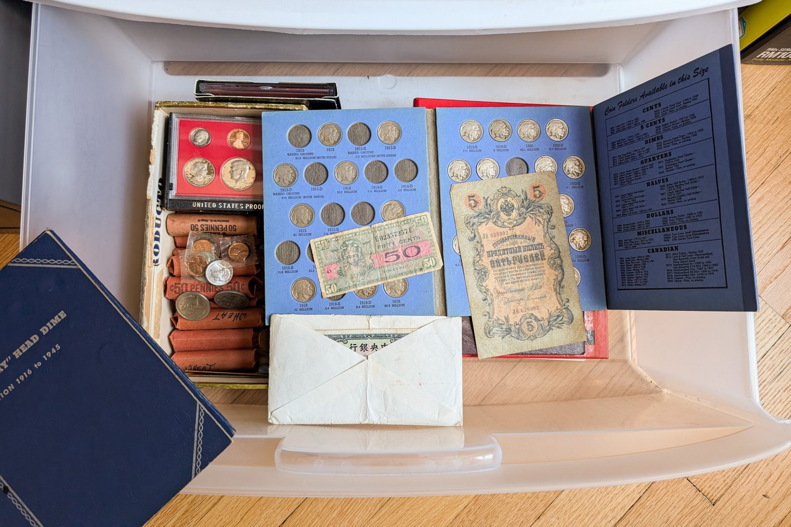 A higher view of several pages contains metal coins.