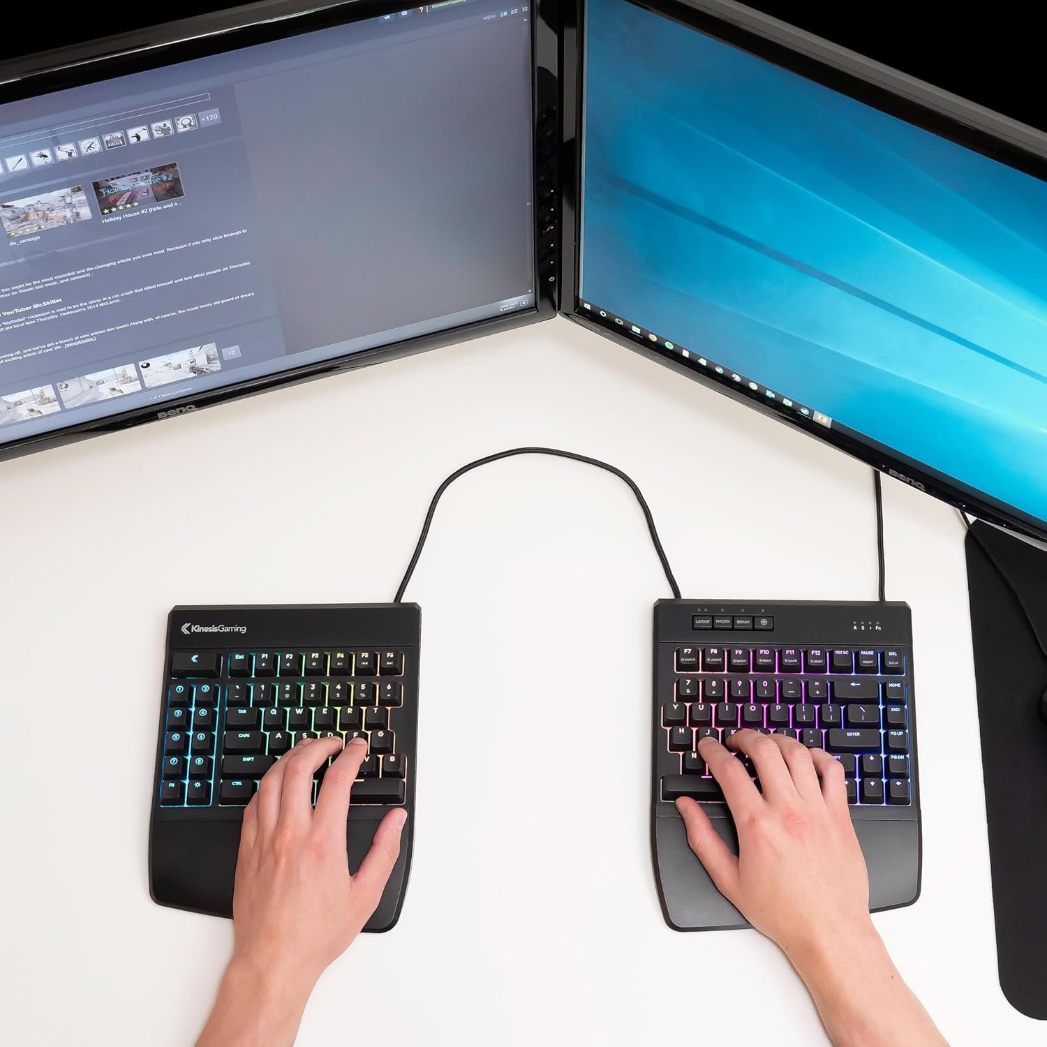 Hands, each of them on half a divided keyboard
