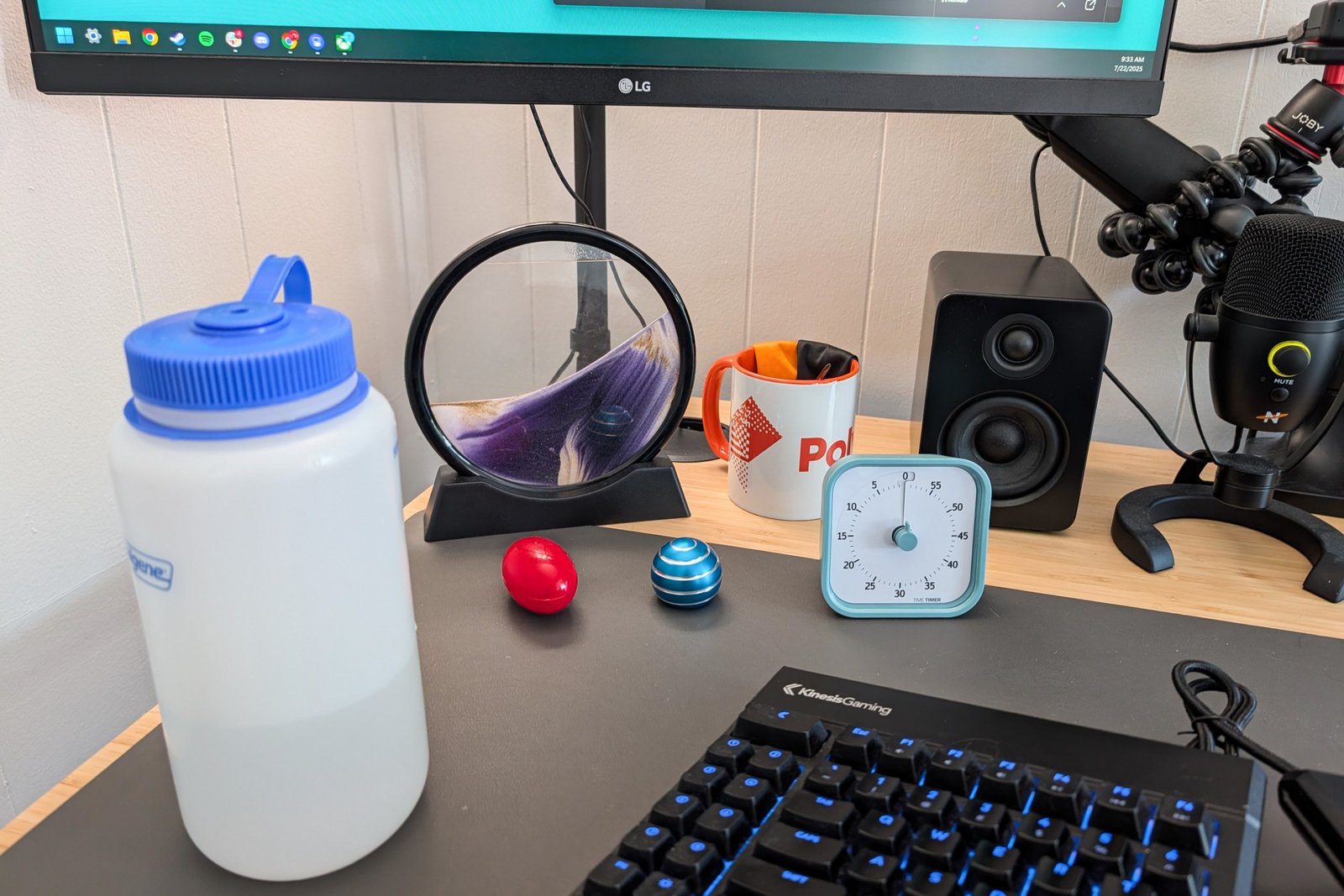 Desk edge with several small games below the screen.