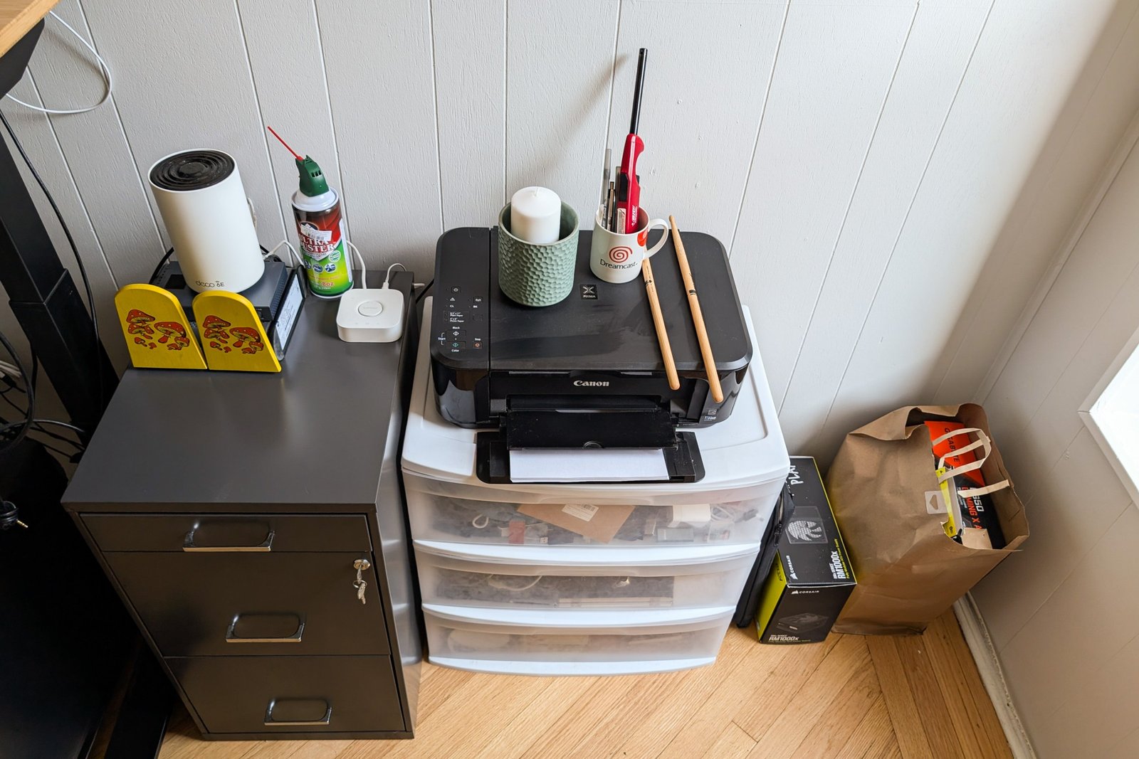 A white set of drawers with a printer above this.