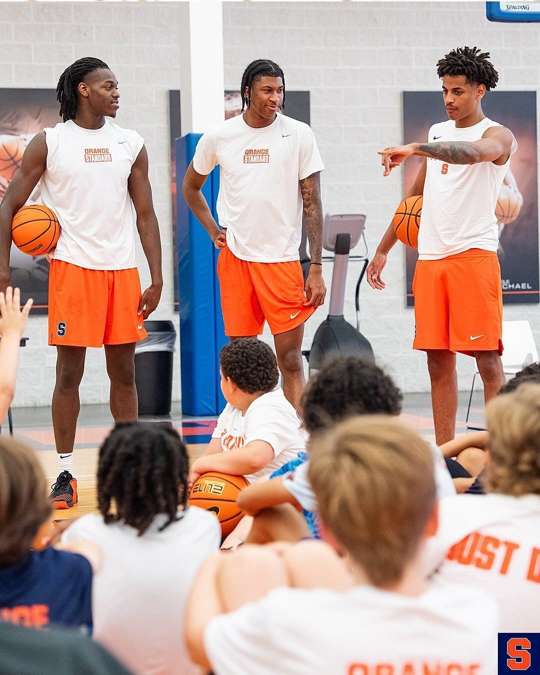 The entity of Anthony, Dunavan Freeman and William Kyle the third provides some tips to the Habers ’youth (image via Instagramcuse_MBB)