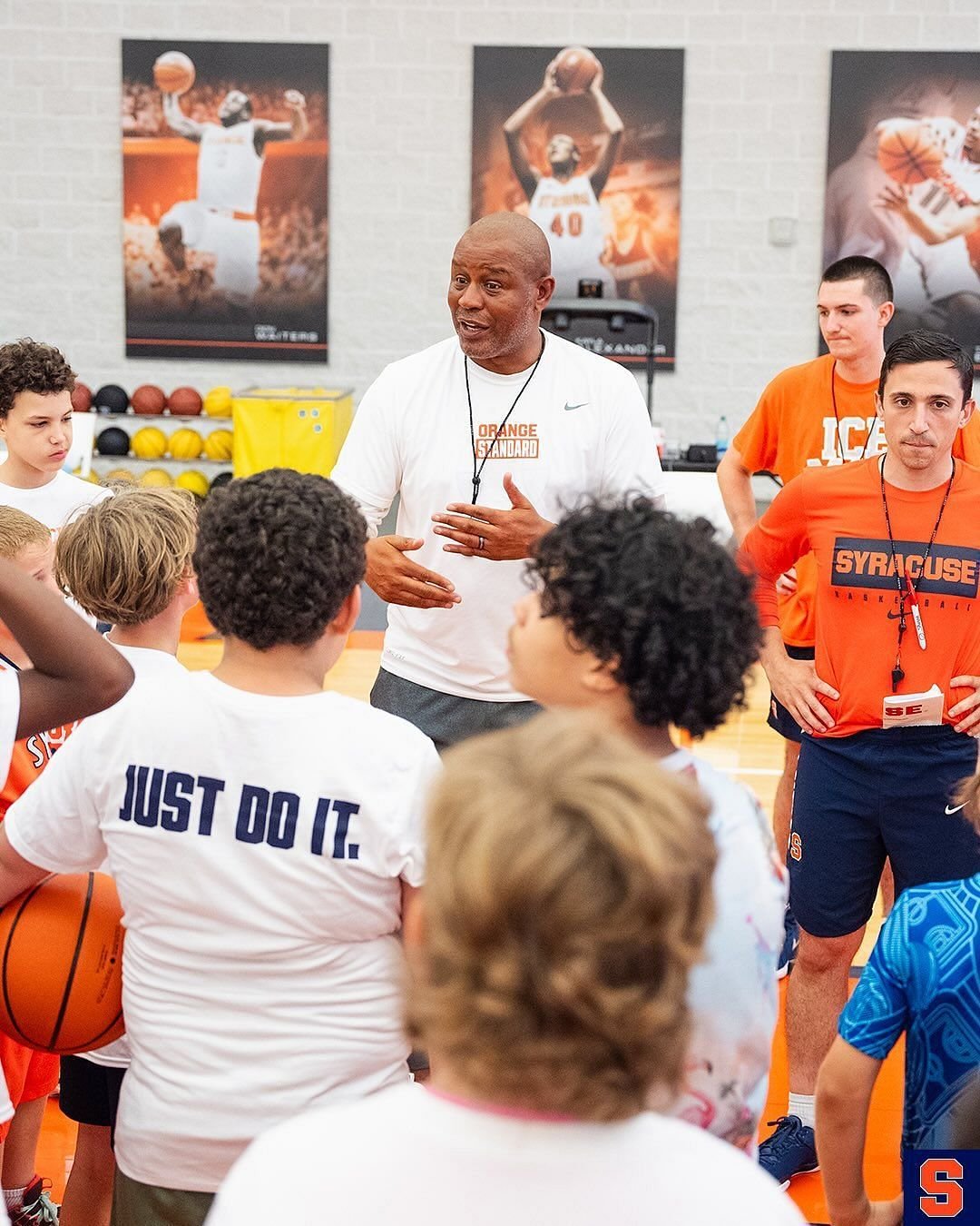 Coach Peter Korasaneti and Red Autry talk to The Young Hoopers in CAMP (image via Instagramcuse_MBB)