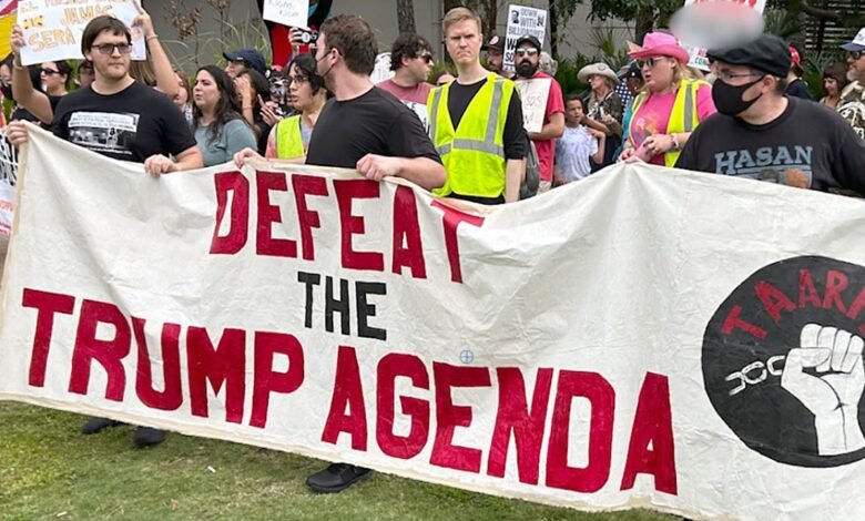 Anti ICE protesters clash with attendees outside TPUSA summit in Tampa.jpg
