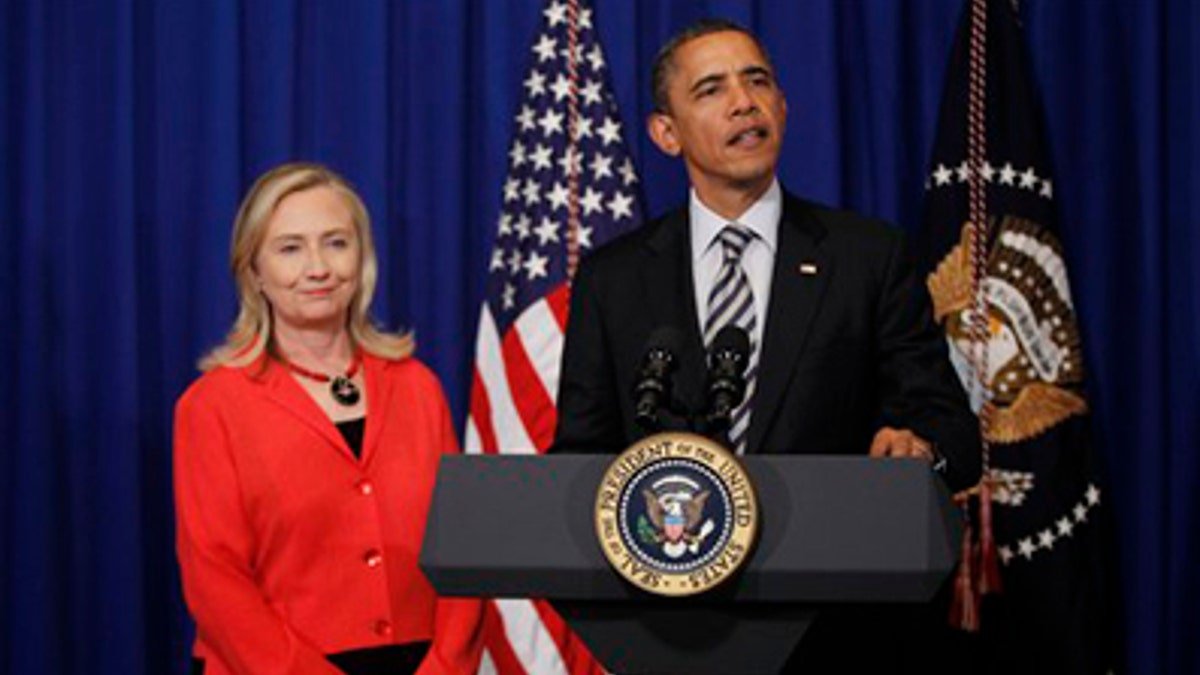 November 18, 2011: US President Obama stands with Foreign Minister Hillary Clinton, where she announces that she will travel to Burma, on the sidelines of the Asian and East Asian summit in Nusa Dua, on Bali Island, Indonesia.