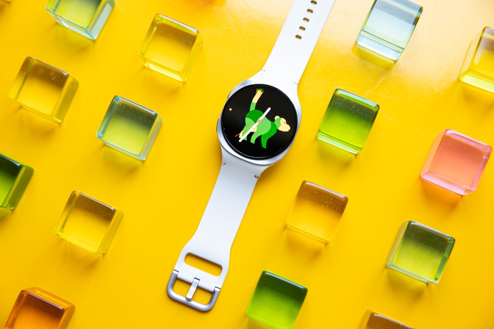 A wide view of watching Samsung Galaxy 8 on a yellow table with green, yellow and orange blocks around it.