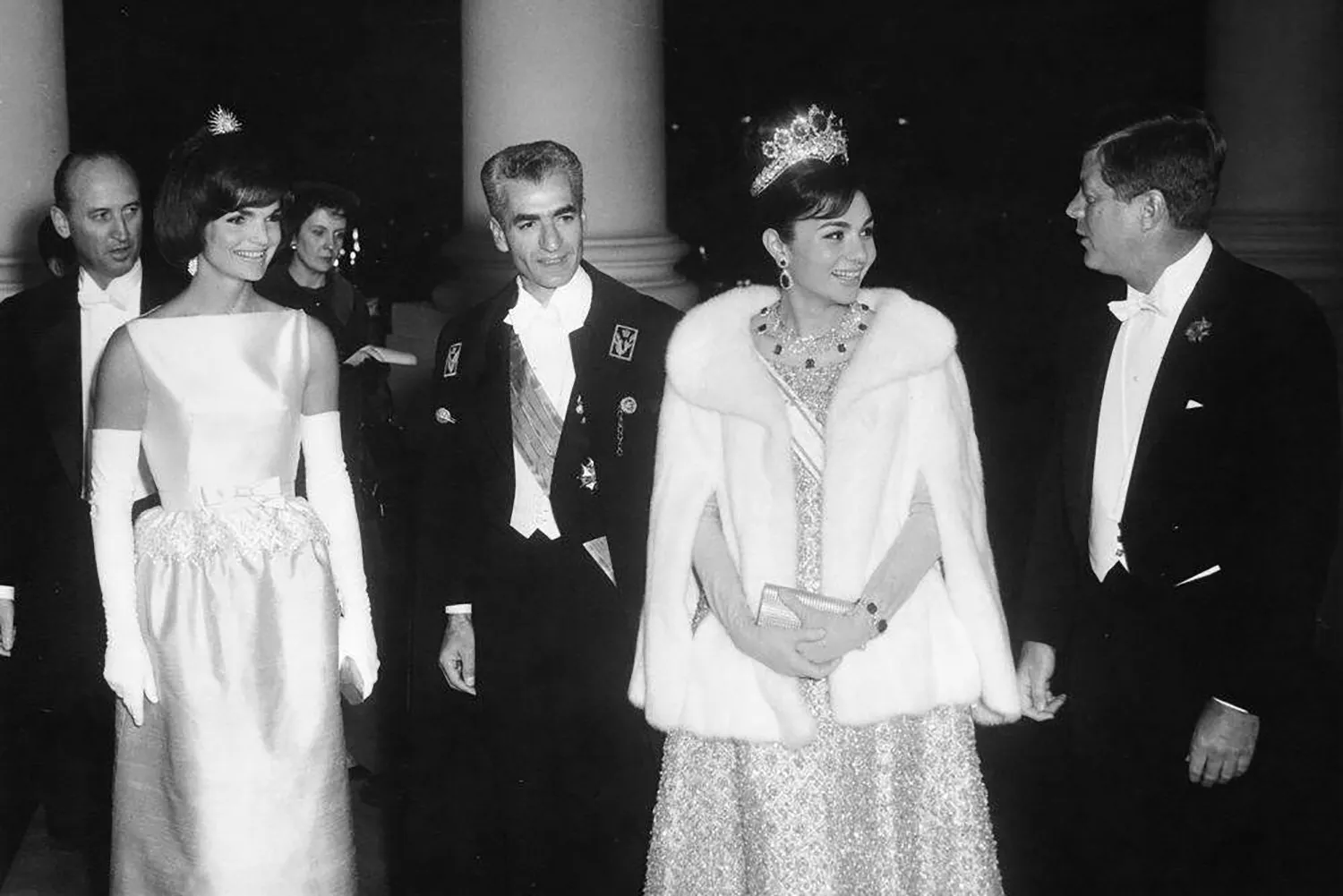 First lady Jacqueline Kennedy and President John F. Kennedy host a dinner in honor of the Shah and Empress of Iran at the White House in 1962.