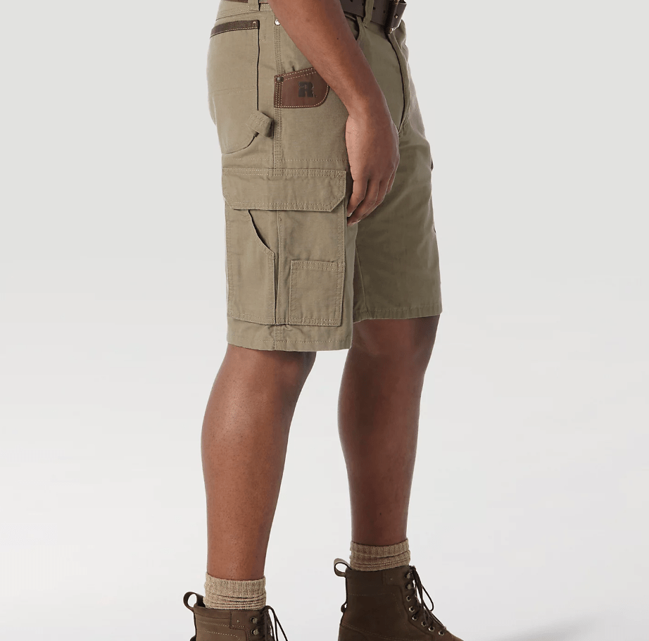 Bottom part of person wearing tan shorts