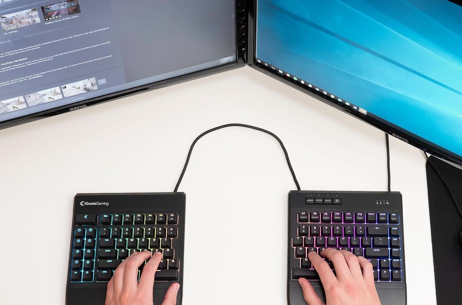 Hands, each of them on half a divided keyboard