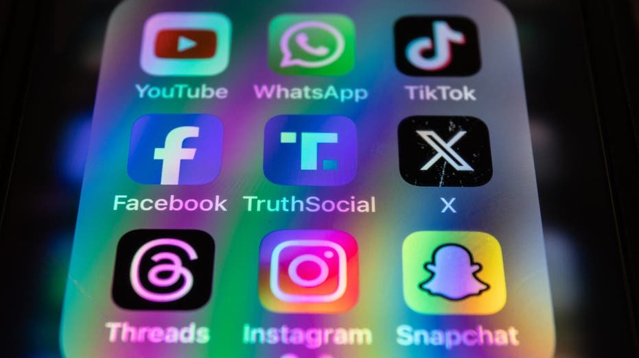 Applications on the cell phone including YouTube, Facebook, Instagram and Snapchat