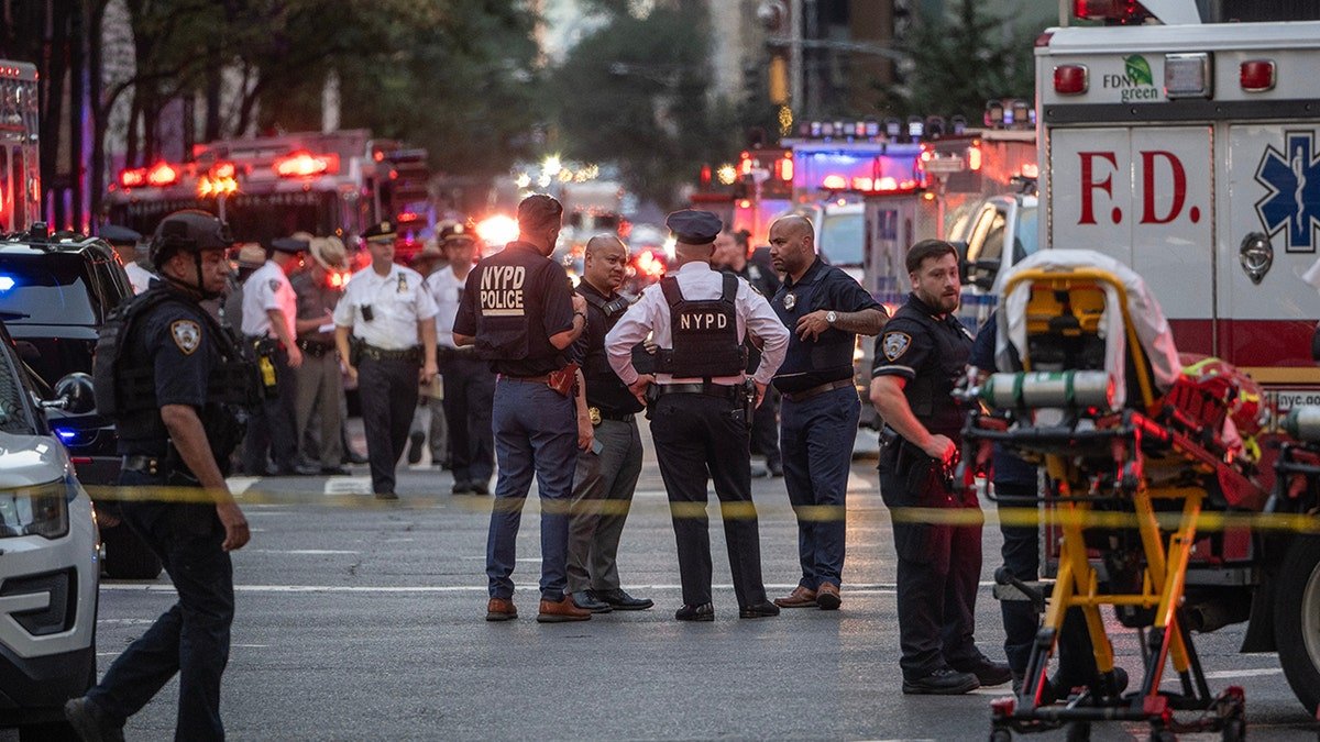 New York police officers at the group shooting site