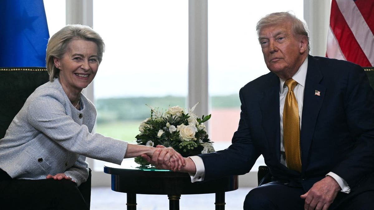 President Donald Trump is walking with European Commission President Ursula von der Lin