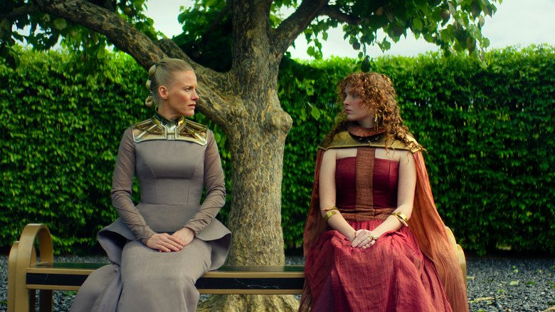 Laura Bern in the role of Demirzel and Rebecca Inson in the role of Zafir Forelis on the garden seat in the Foundation Season 3