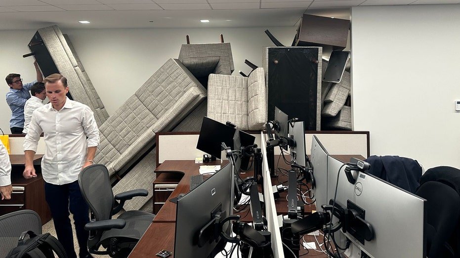 Office workers are attending themselves in an office in New York City, where there is an active shooter on their land